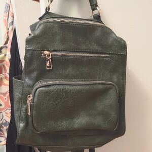 Backpack purse greem leather two ways to carry on shoulders or back plaid lining